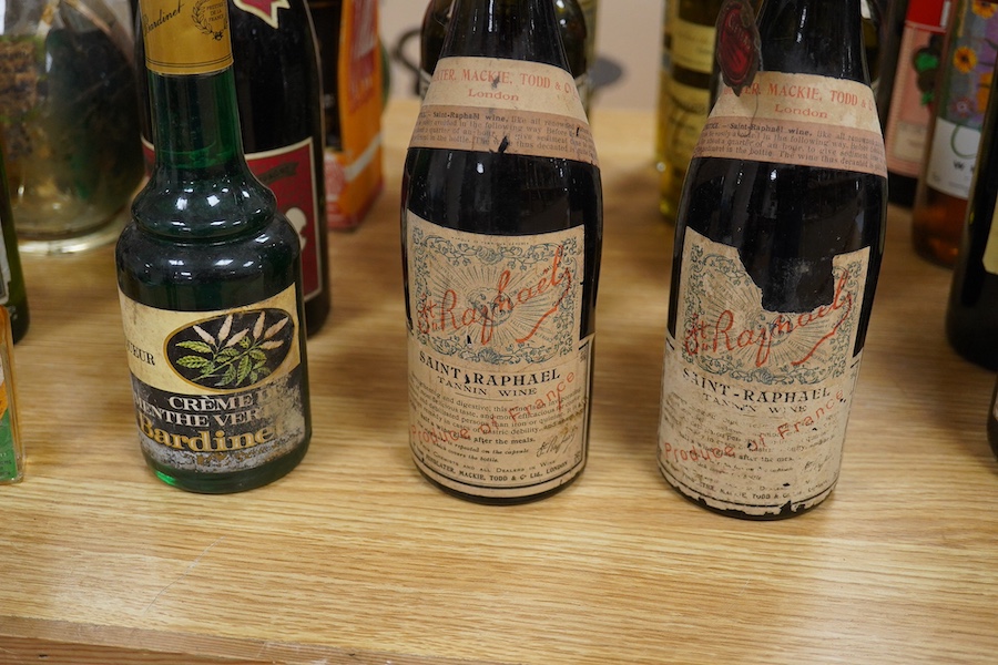 Twenty bottles of spirits, liqueurs and wine, together with some half bottles and miniatures, including; a 1947 Heidsieck & Co. Dry Monopole champagne, a 1983 Chateau Ferrande Bordeaux, two bottles of Herbes Mesclades, a